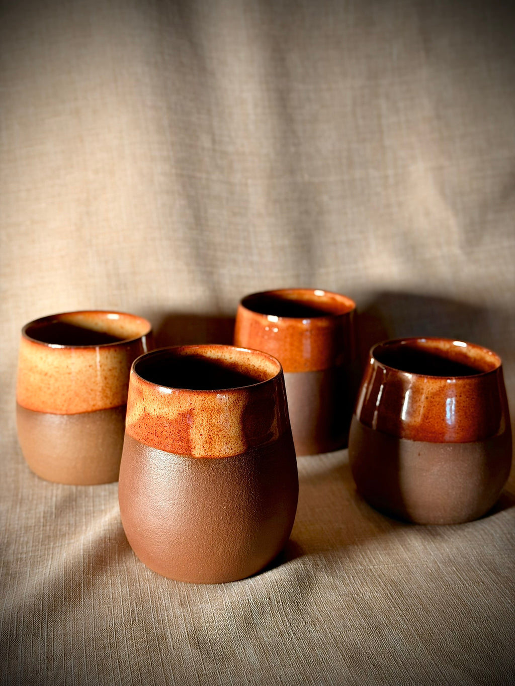 Set of stemless stoneware wine glasses in rust glaze, handmade by VanWest Studios