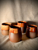 Set of stemless stoneware wine glasses in rust glaze, handmade by VanWest Studios