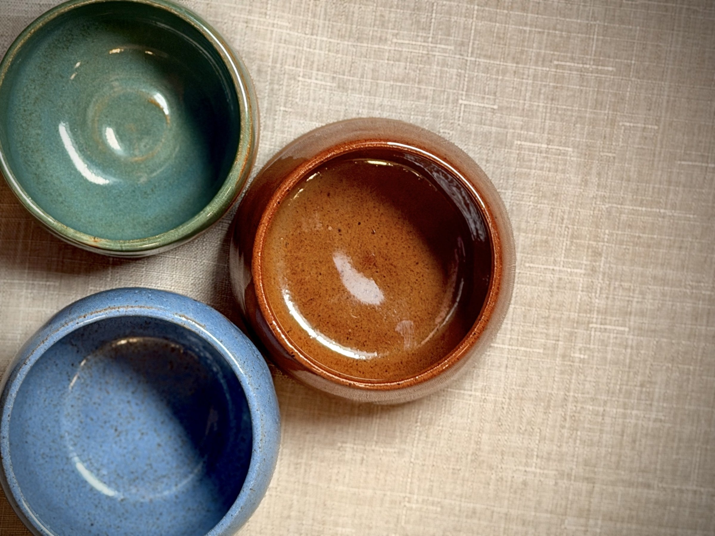 Handmade ceramic espresso cups in green, rust, and blue glazes — VanWest Studios